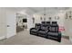 Basement home theater with tiered seating and a projector screen for entertainment at 4001 Ainsley Ave, Orlando, FL 32833