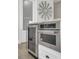 Modern kitchen appliances including KitchenAid oven and microwave are set into white cabinets at 4001 Ainsley Ave, Orlando, FL 32833