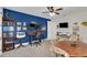 Spacious office with blue accent wall, custom built ins, and two work stations at 4001 Ainsley Ave, Orlando, FL 32833