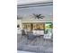 Covered patio with comfortable seating area, seamless access to indoor living spaces and scenic views at 4001 Ainsley Ave, Orlando, FL 32833