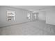 Spacious carpeted room with natural light at 7247 Rolling Leaf Rd, Groveland, FL 34736