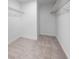 Walk-in closet with carpet flooring and wire shelving ready to be organized at 7247 Rolling Leaf Rd, Groveland, FL 34736
