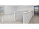 Bright upstairs landing with neutral carpet, white walls and natural light at 7247 Rolling Leaf Rd, Groveland, FL 34736