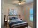 Simple bedroom with a full size bed, hardwood floors, and natural light at 1833 Queen Palm Dr, Apopka, FL 32712