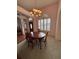 Elegant dining room, chandelier, and wood flooring at 1833 Queen Palm Dr, Apopka, FL 32712