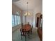 Formal dining room with chandelier and oval table at 1833 Queen Palm Dr, Apopka, FL 32712