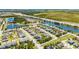 Community aerial view with lake and greenery, close to highway, and well-maintained landscaping at 1911 Betsy Ross Ln, St Cloud, FL 34769