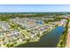 Aerial view showcasing a community with lakes, lush greenery, and well-maintained landscaping at 1911 Betsy Ross Ln, St Cloud, FL 34769