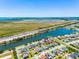 Aerial view of a home near a lake and highway, showcasing the neighborhood and surroundings at 1911 Betsy Ross Ln, St Cloud, FL 34769