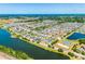 Aerial view of a community with lakes, a playground, and well-maintained landscaping at 1911 Betsy Ross Ln, St Cloud, FL 34769