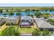 Aerial view of a backyard featuring a screened-in pool and well-maintained lawn at 1911 Betsy Ross Ln, St Cloud, FL 34769