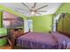 Cozy bedroom features a ceiling fan and large television for comfortable living at 1911 Betsy Ross Ln, St Cloud, FL 34769