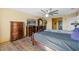 Comfortable bedroom with wood floors, ceiling fan and complete with television and dressers at 1911 Betsy Ross Ln, St Cloud, FL 34769