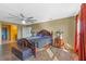 A cozy bedroom with a carved wood bed frame and an adjoining bathroom featuring warm, sunny colors at 1911 Betsy Ross Ln, St Cloud, FL 34769