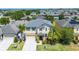 Inviting two-story home featuring a well-manicured front yard and a welcoming entrance at 1911 Betsy Ross Ln, St Cloud, FL 34769