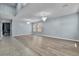 Bright living room featuring hard surface floors and modern chandeliers at 1911 Betsy Ross Ln, St Cloud, FL 34769