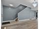 Bright living room with hard surface floors and stairway at 1911 Betsy Ross Ln, St Cloud, FL 34769