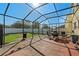 Outdoor patio perfect for dining with screened in enclosure at 1911 Betsy Ross Ln, St Cloud, FL 34769