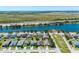 Street view of homes near a lake, featuring well-maintained lawns and landscaping at 1911 Betsy Ross Ln, St Cloud, FL 34769
