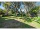 Spacious backyard with grass and wooded landscape at 33629 Wesley Rd, Eustis, FL 32736