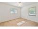 Bare bedroom featuring natural light from the windows, neutral walls and ceiling fan at 33629 Wesley Rd, Eustis, FL 32736