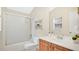 Clean bathroom with a shower-tub, vanity, and neutral fixtures, offering comfort and functionality at 1957 Teaberry Ct, Orlando, FL 32824