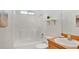 Clean, well-maintained bathroom with a tub and shower combination and wood vanity at 1957 Teaberry Ct, Orlando, FL 32824