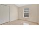 The simple bedroom has a closet and a window for natural light, creating a basic living space at 1957 Teaberry Ct, Orlando, FL 32824