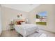 Cozy bedroom with a comfortable bed, bright window, and neutral decor that creates a relaxing space at 1957 Teaberry Ct, Orlando, FL 32824