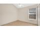 The spare bedroom has a closet and a window for natural light, offering a blank canvas at 1957 Teaberry Ct, Orlando, FL 32824