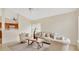 Bright living room featuring neutral tones, comfortable seating, and a ceiling fan for added comfort at 1957 Teaberry Ct, Orlando, FL 32824