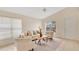 Bright living room features neutral décor, tile flooring, and vaulted ceilings at 1957 Teaberry Ct, Orlando, FL 32824