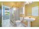 Bathroom featuring a tiled floor, glass enclosed shower, and pedestal sink at 2523 Madron Ct, Orlando, FL 32806
