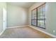 Cozy bedroom with carpet, a window, and neutral wall color at 2523 Madron Ct, Orlando, FL 32806