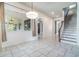 Bright dining room featuring tile floors, pendant lighting, and access to outdoor space at 2523 Madron Ct, Orlando, FL 32806