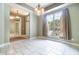 Well lit dining room with large window and custom cabinetry at 2523 Madron Ct, Orlando, FL 32806