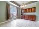 Elegant dining room with ample natural light, stylish chandelier, and custom cabinets at 2523 Madron Ct, Orlando, FL 32806