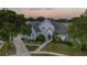 Charming home exterior featuring a well-manicured lawn, tasteful landscaping, and an inviting entrance with lovely walkway at 2523 Madron Ct, Orlando, FL 32806