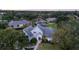 Elegant home exterior showcasing lush greenery, mature trees, and a pristine lawn at 2523 Madron Ct, Orlando, FL 32806
