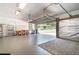 Spacious garage with ample storage and a semi-open door, providing great outdoor access at 2523 Madron Ct, Orlando, FL 32806