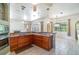 Open concept kitchen with counter seating and views into the Gathering room at 2523 Madron Ct, Orlando, FL 32806