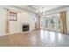 Inviting living area with fireplace, tile floors, and doors leading to outdoor space at 2523 Madron Ct, Orlando, FL 32806