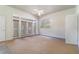 Bright living room with natural light, ceiling fan, and glass doors at 2523 Madron Ct, Orlando, FL 32806