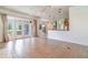 Open-concept living space with doors to the patio and tile floors at 2523 Madron Ct, Orlando, FL 32806