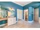 Bright primary bath with a vanity, sink, and a large walk in shower at 2523 Madron Ct, Orlando, FL 32806