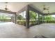 Relax in this large covered patio, with ceiling fans and views of the lush backyard at 2523 Madron Ct, Orlando, FL 32806