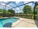 Screened-in pool area offering beautiful water views, a pool, and outdoor seating at 2523 Madron Ct, Orlando, FL 32806