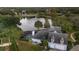 Gorgeous rear view showing a screened pool, lush backyard, and architectural details at 2523 Madron Ct, Orlando, FL 32806