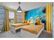 Charming bedroom with custom mural, playful decor, and lots of natural light at 3955 Lana Ave, Davenport, FL 33897