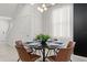 The dining room features stylish décor, including modern lighting and a decorative accent wall at 3955 Lana Ave, Davenport, FL 33897